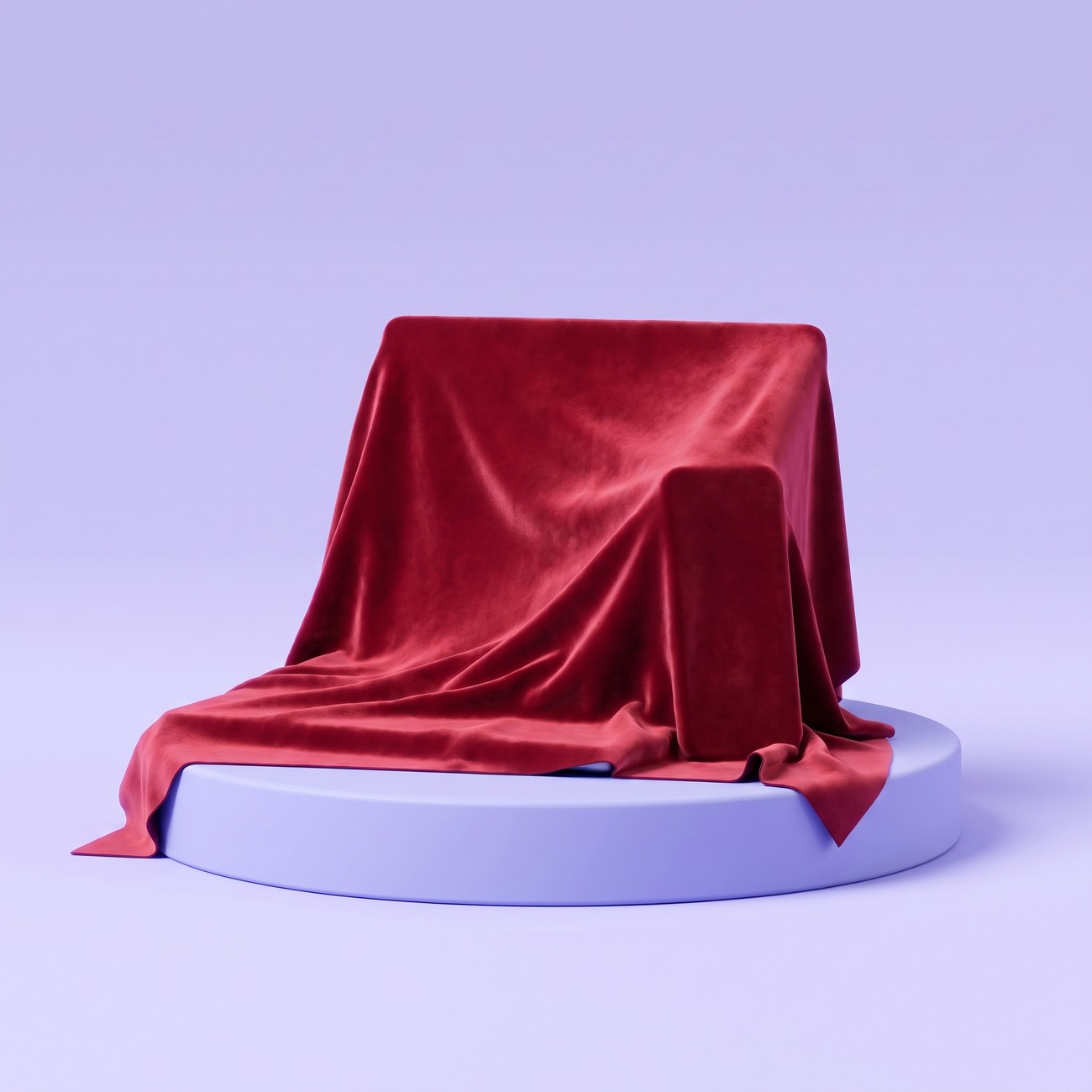 Het nieuwe product onder een rood fluwelen doek op een sokkel, je herkent de vorm van een laptop en een telefoon